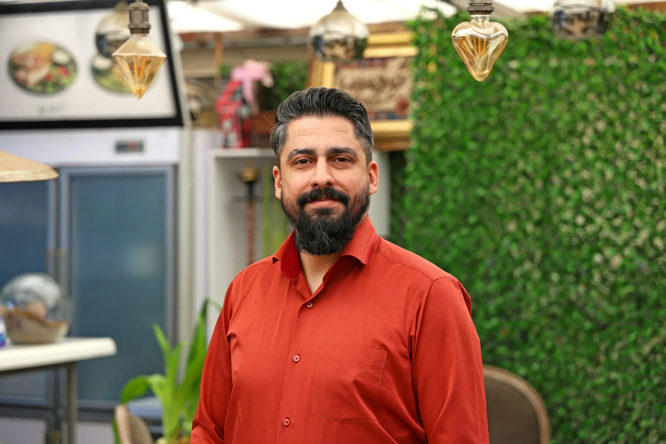 Smiling small business owner in his shop