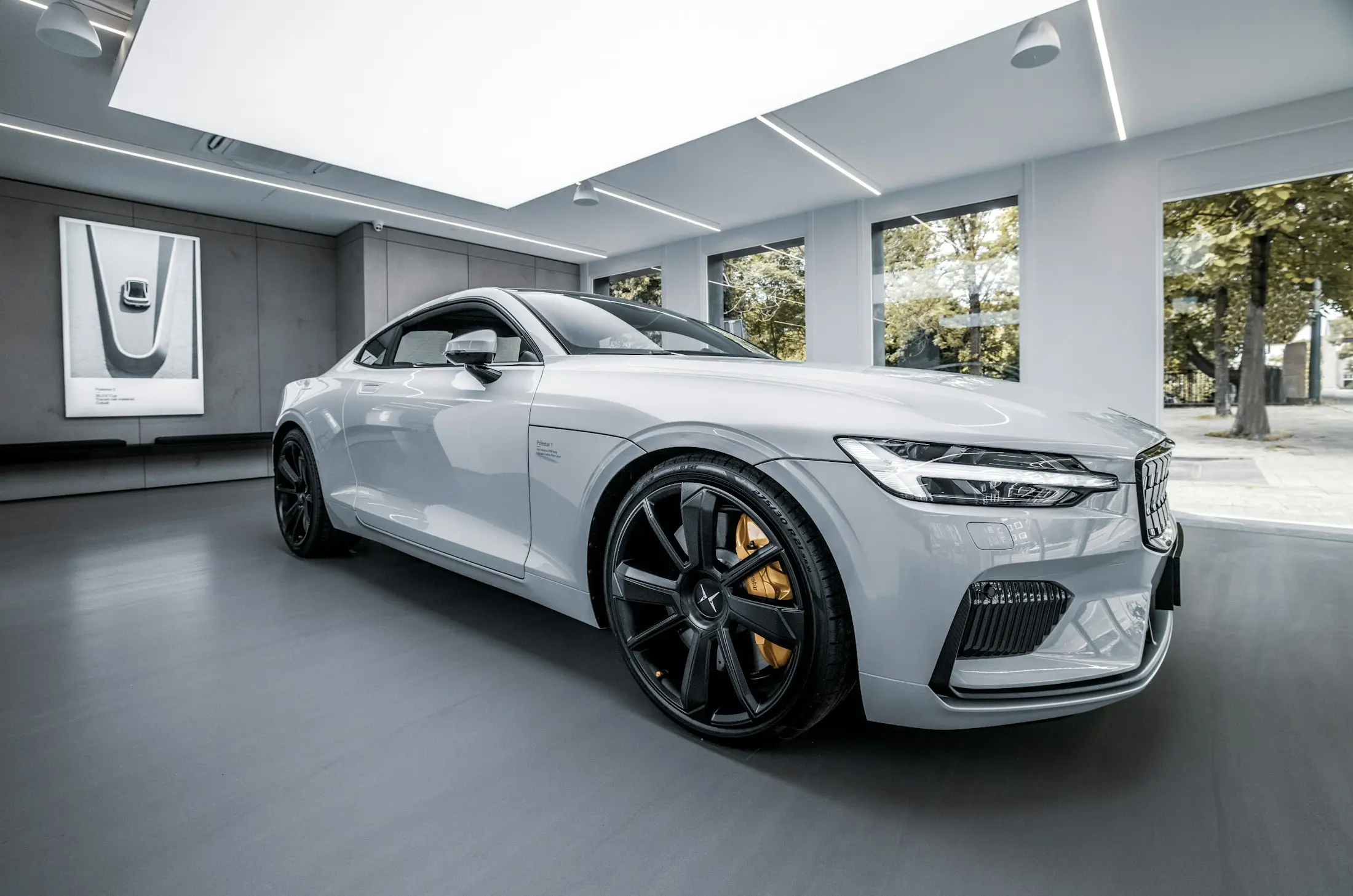 Silver electric fastback in a bright modern showroom