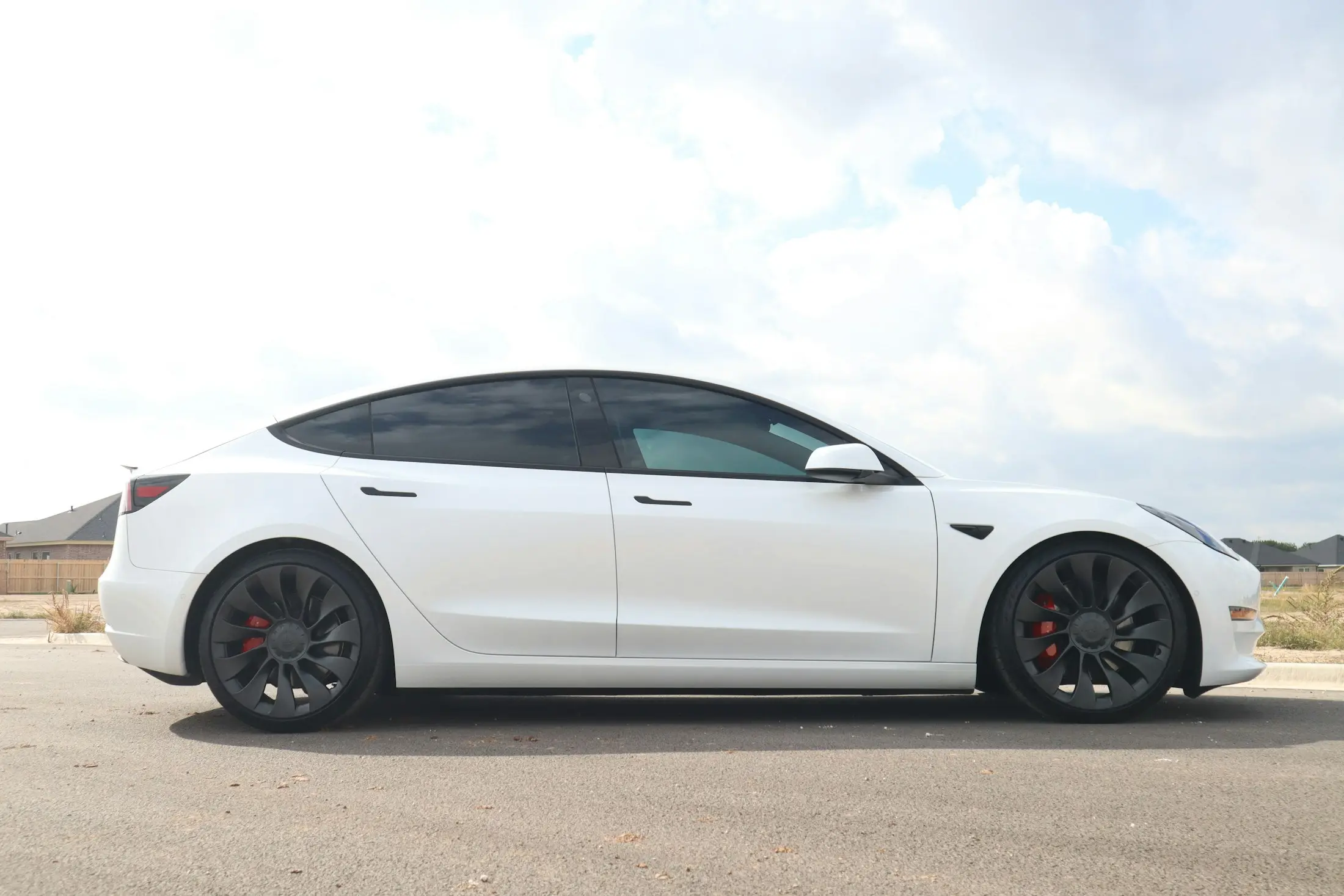 White electric sedan in profile