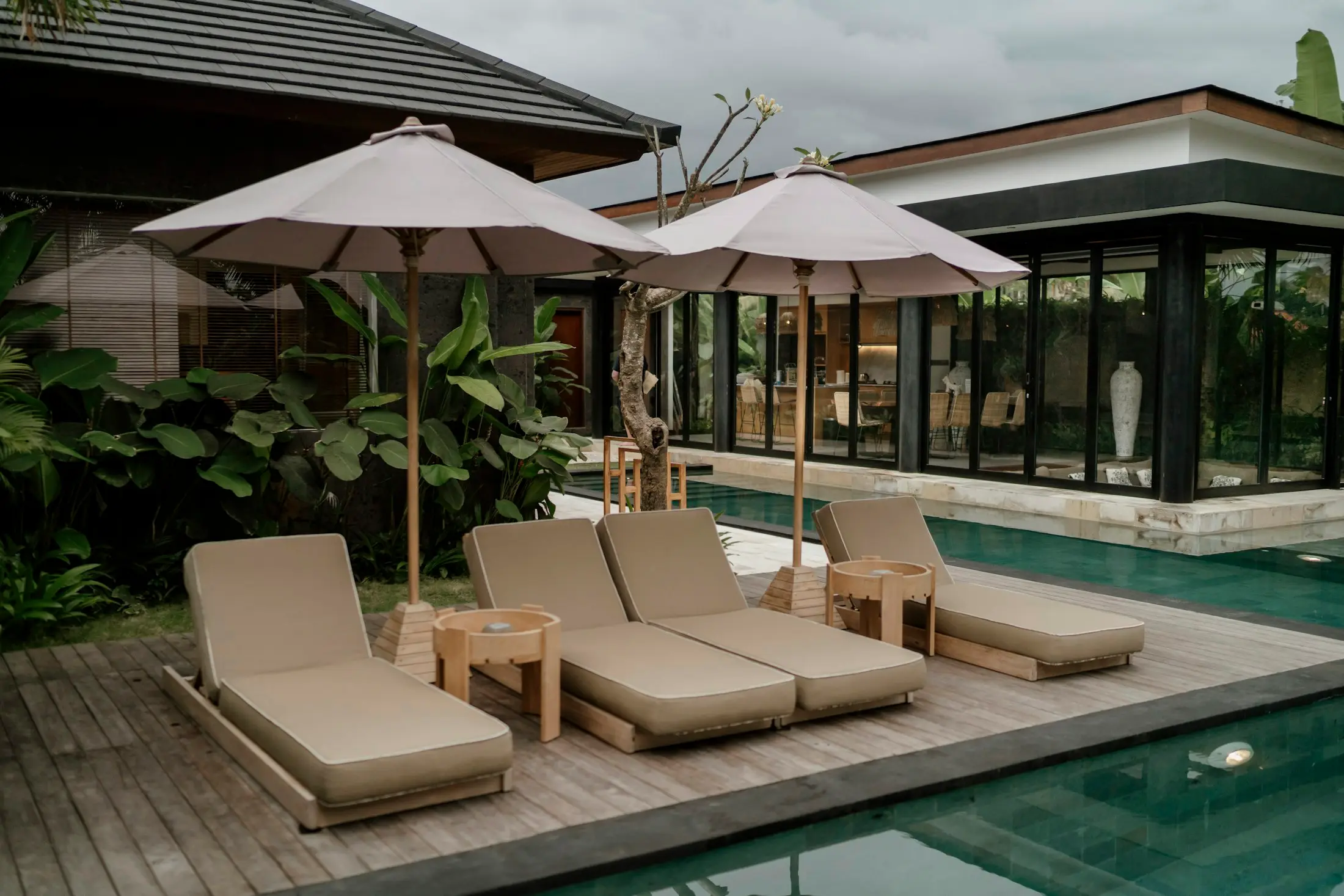 Sun loungers beside a resort-style pool