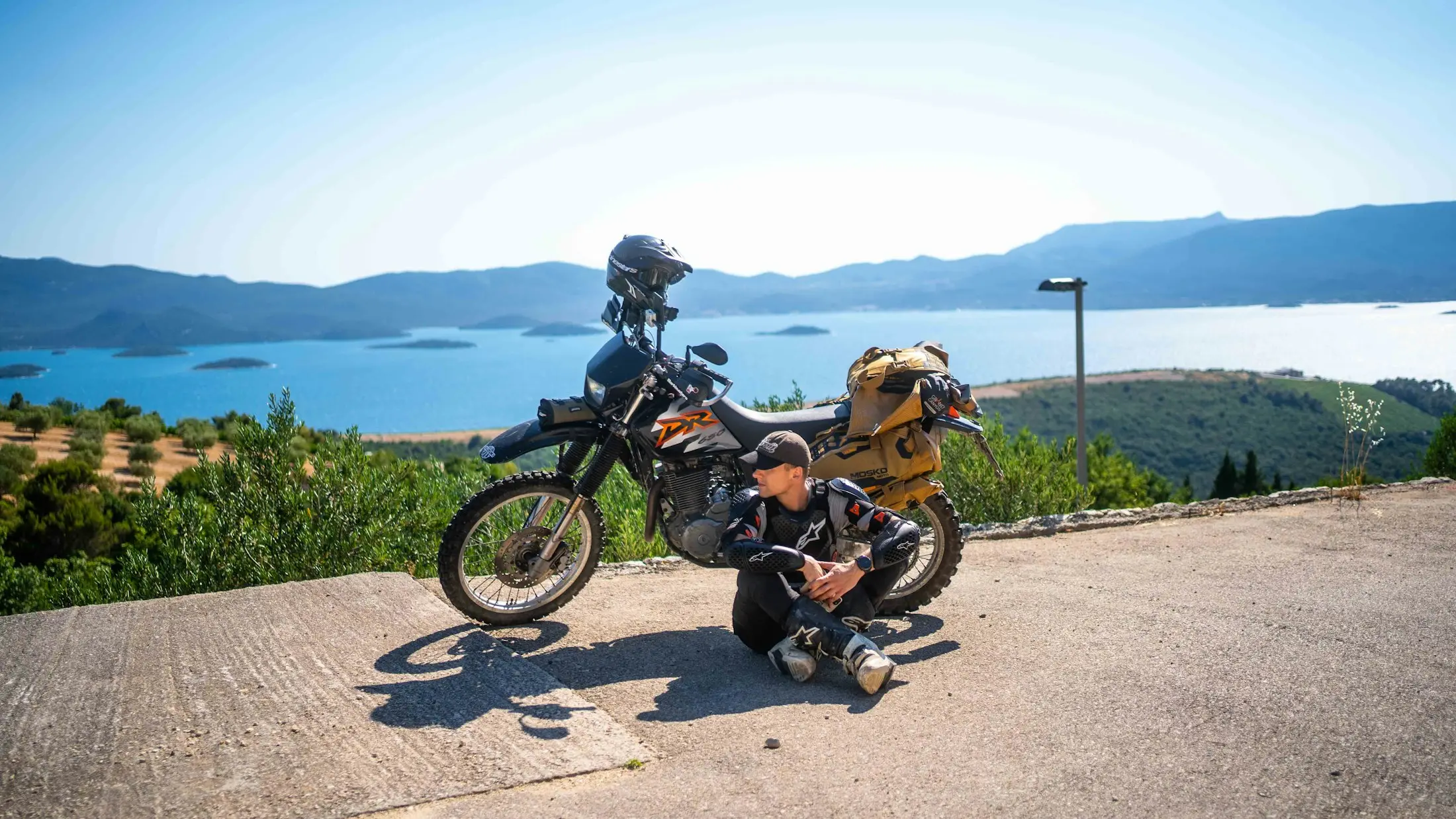 Adventure motorbike parked at a coastal lookout