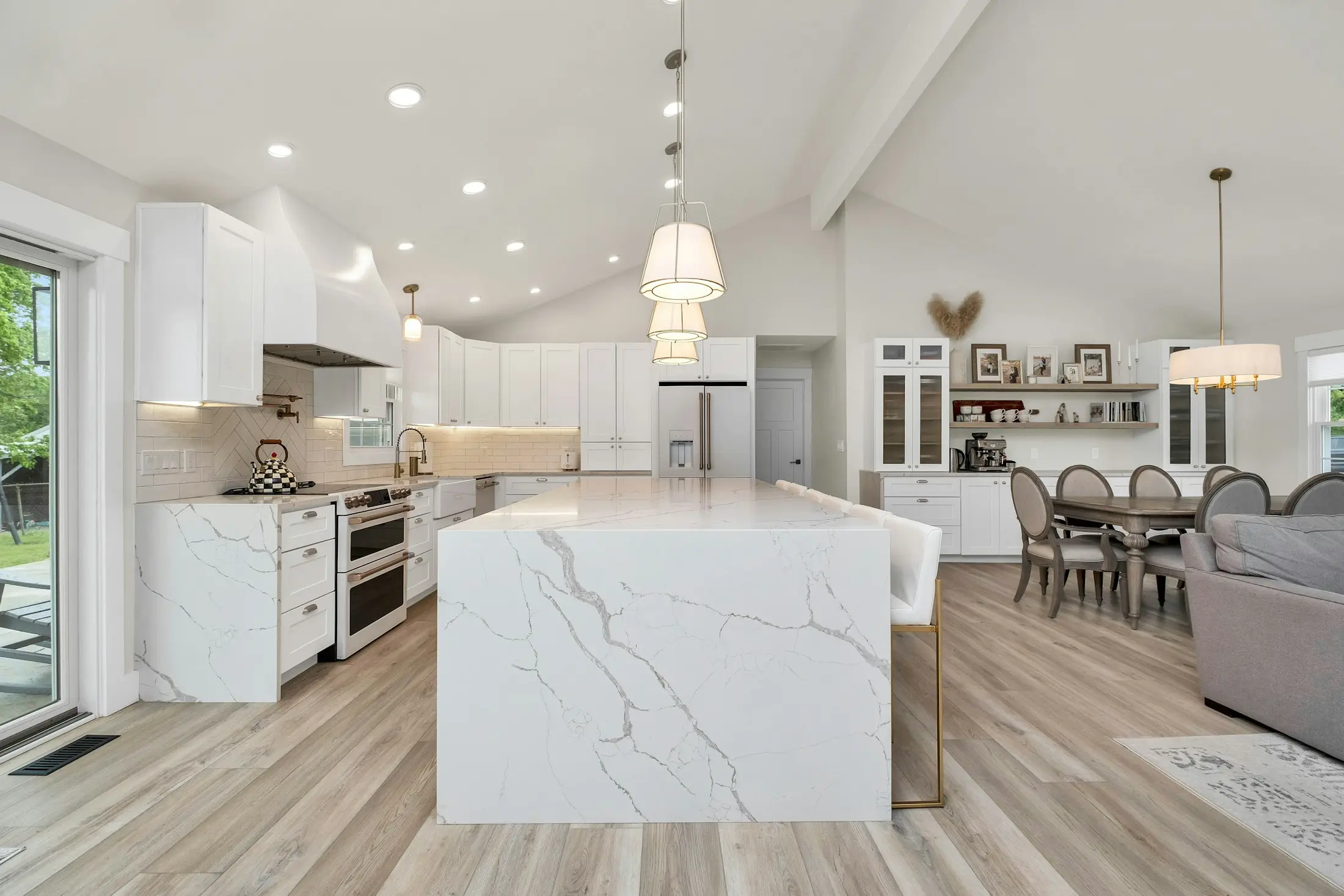 White kitchen with a marble-look island bench