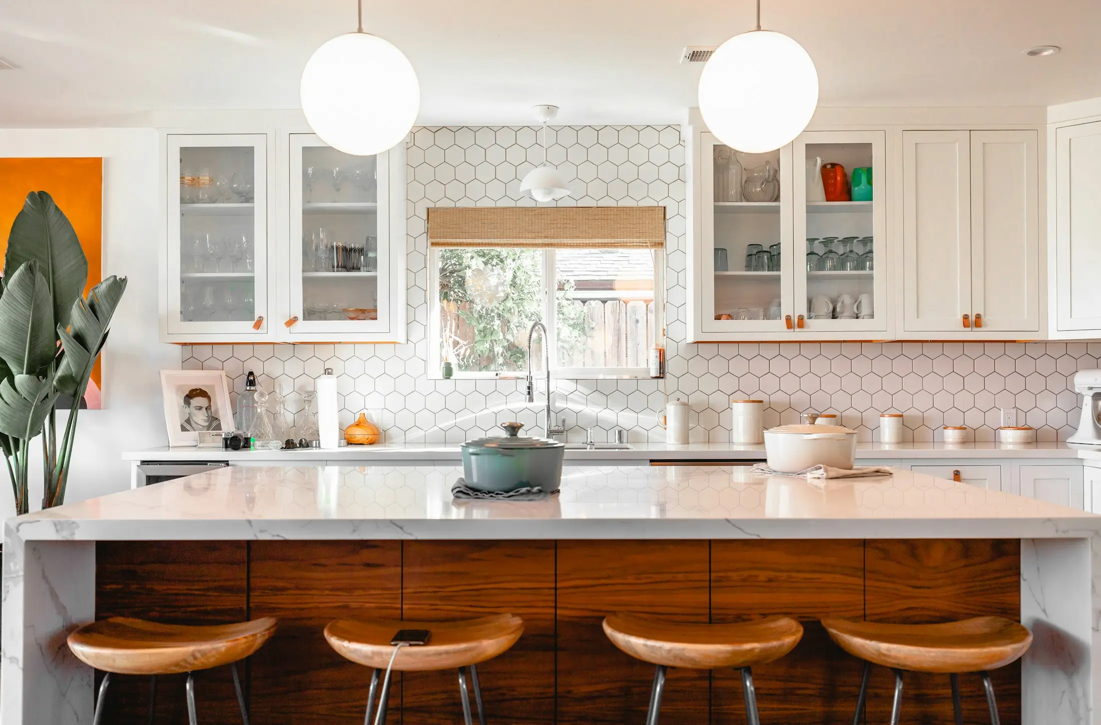 Bright renovated kitchen with timber bar stools