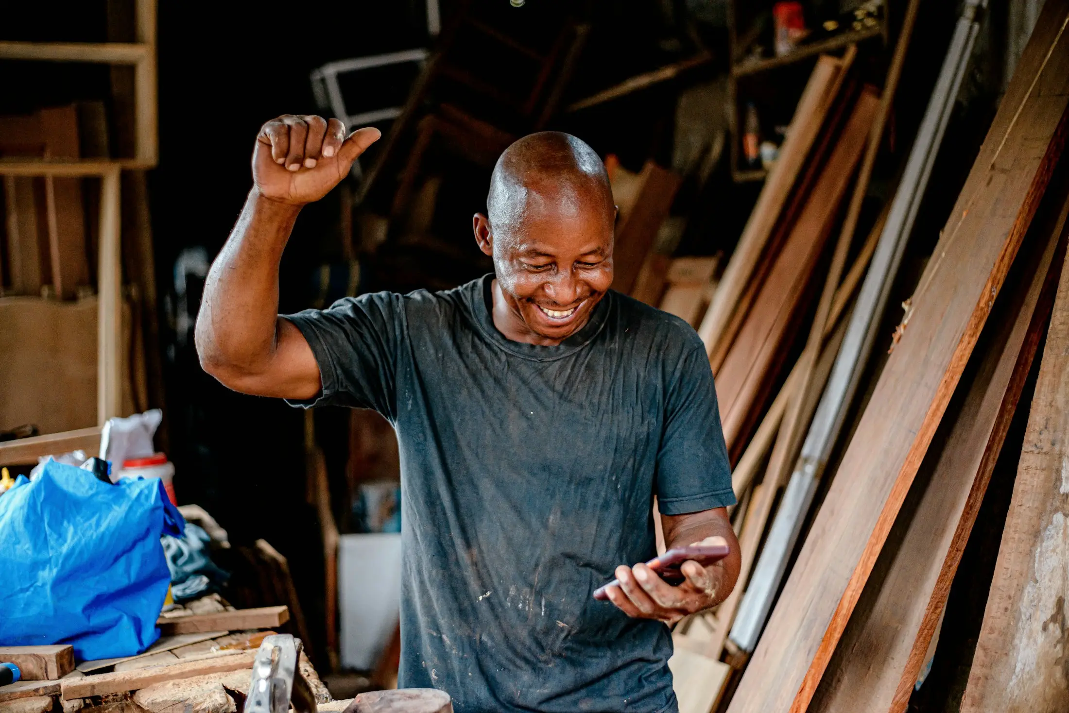 Carpenter smiling in his timber workshop